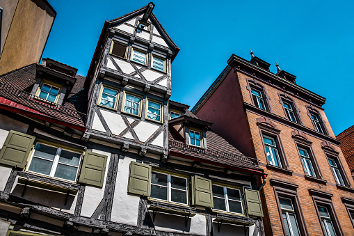 on a very sunny day end of may in south german historical city ancient facades and roofs of pastell colors are inspiring views of contemplation