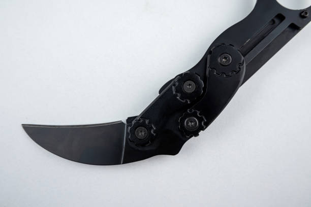 istock one black karambit combat knife isolated on white background. 1490944557