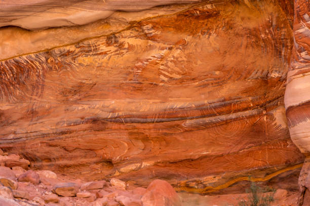Multi-colored sandstone rock and mineral layers in ancient tombs of Petra, Jordan. Pattern, geological stone texture