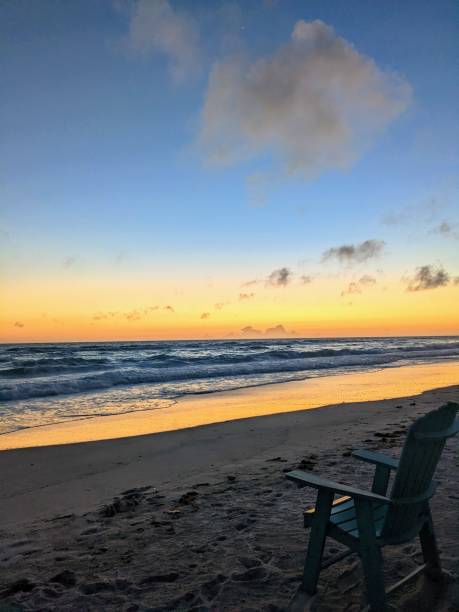 Lone chair Beach chair at sunset longboat key stock pictures, royalty-free photos & images