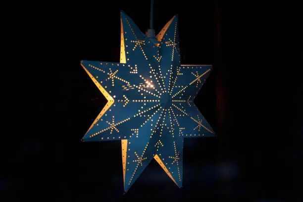 Christmas star from the side hanging in window