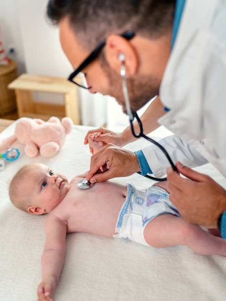 istock A smiling pediatrician holding a stethoscope to a baby 1490954353