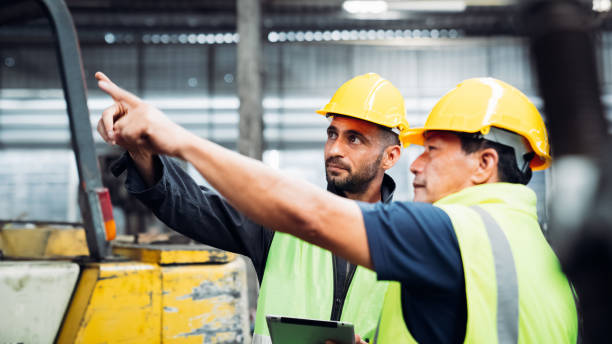 istock Team engineer are working in the factory. Mechanical technicians are maintaining the engine. 1490956337