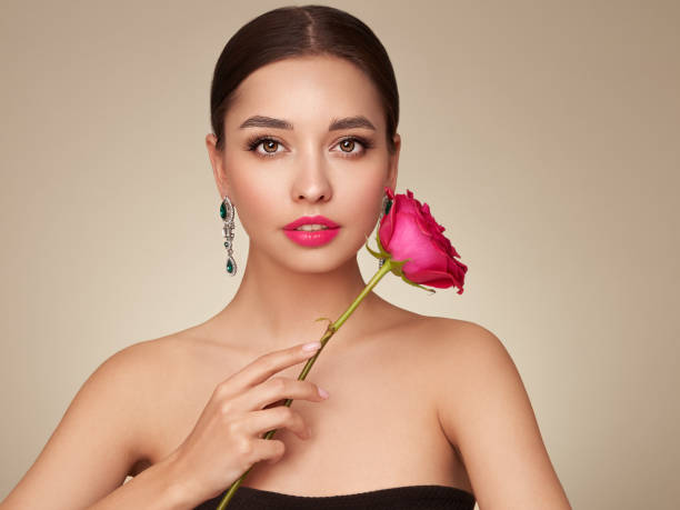 istock Beautiful young woman a rose flower 1490956574