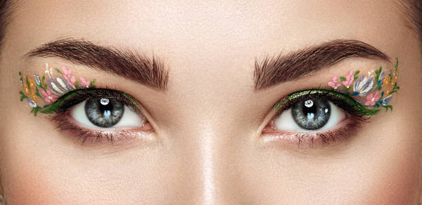 istock Female eye with flower makeup eyes 1490957052