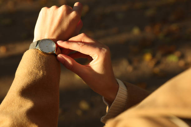 istock Woman checking time on watch outdoors, closeup. Being late concept 1490965088