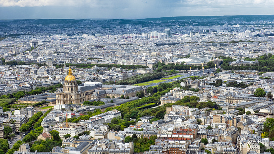 aerial shot of Trocadero, Jardins du Trocadero, Palais de Chaillot in Paris. The business district of La Defense, sits in the background just outside of Paris proper.
