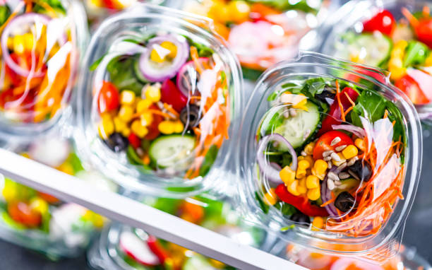 istock Boxes with pre-packaged vegetable salads in a commercial fridge 1490968177