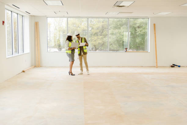 istock Business professionals meet at the construction site to compare notes and inspect the project tasks 1490970103