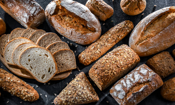 istock Assorted bakery products including loafs of bread and rolls 1490971680