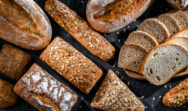 istock Assorted bakery products including loafs of bread and rolls 1490971713
