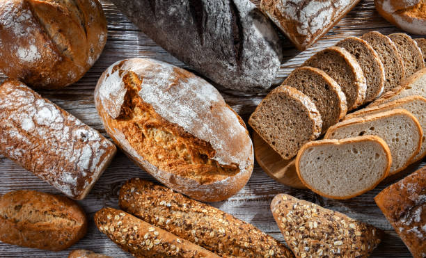 istock Assorted bakery products including loaves of bread and rolls 1490973404