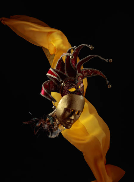 istock Old carnival masks with flutters yellow cloth. 1490975271