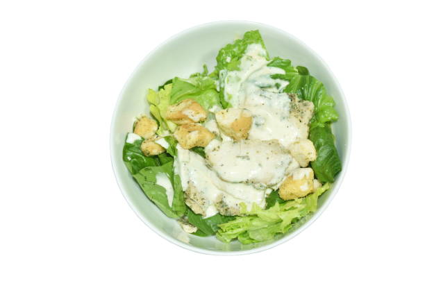 Salad Caesar Served In White Ceramic Dish On Wood Table