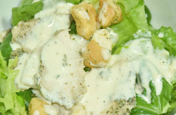 istock Caesar salad with slice boiled black pepper chicken breast topping crispy bread 1490979418