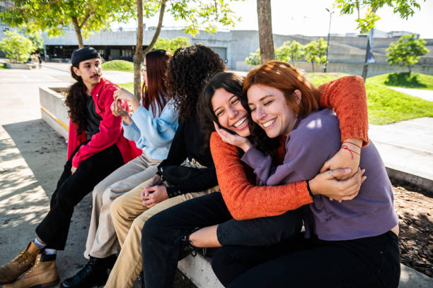 istock Young friends/students talking while having fun at street 1490980615