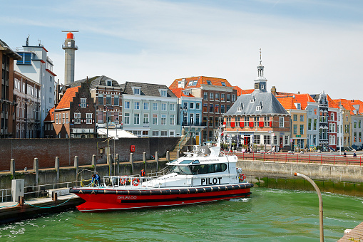 Vlissingen, Netherlands - May 14, 2023. A pilot boat in the small historic harbor of the old town of Vlissingen. Pilot boats guide ships through the estuary of the Western Scheldt (Westerschelde) on their way to Antwerp, Belgium.