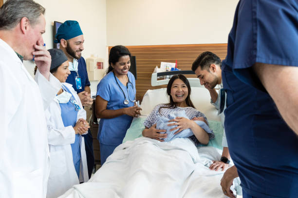 istock Multiracial ER team involved in emergency delivery visits new mom 1490982200