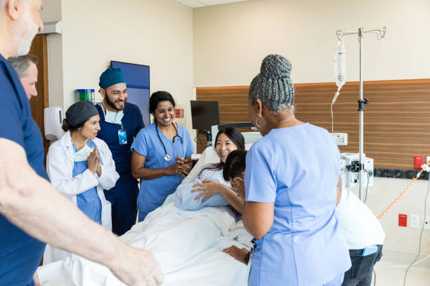 istock Diverse emergency room team celebrates with new parents 1490982275
