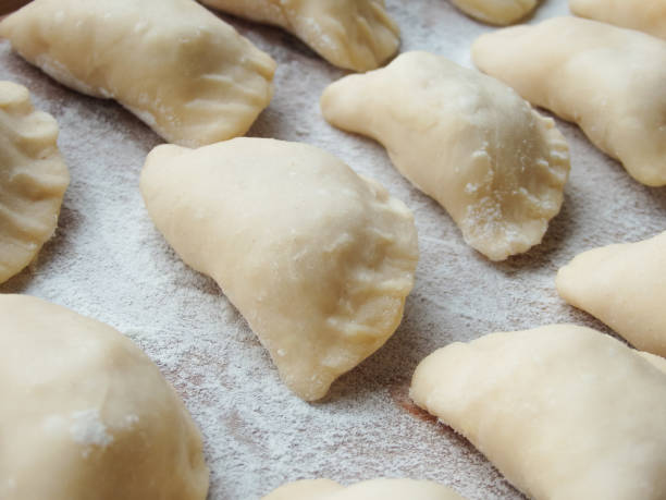 istock cooking. Dumplings with cheese. Ready for cooking dumplings with cottage cheese. 1490984582