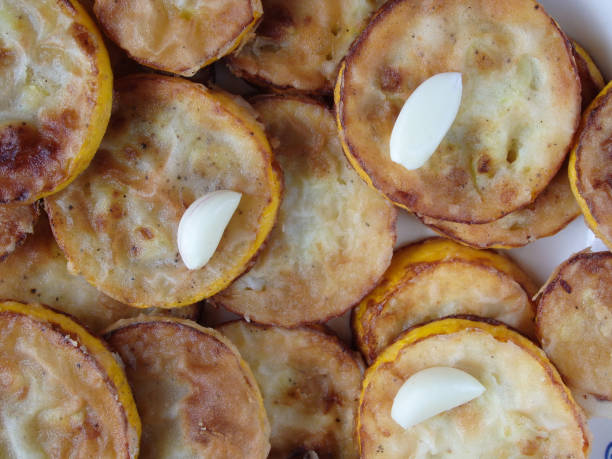 istock Fried Courgettes With Garlic. Fried zucchini, top view 1490984638