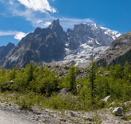 Asphalt winding road in mountains. Giau Pass (altitude meters 2.236) in Dolomites. Italy.