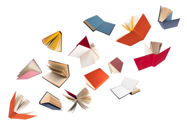 istock Colorful hardcover books flying on white background. 1490986096