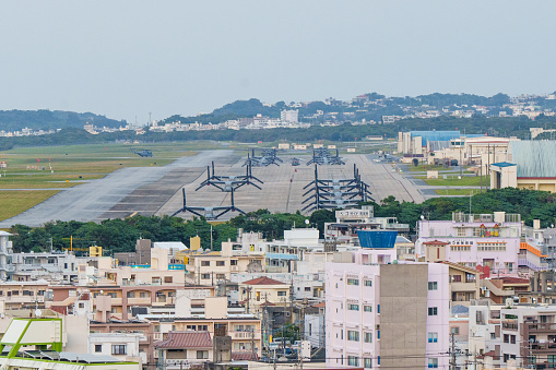 This photo shows U.S. Futenma Airfield in Ginowan, Okinawa, shot on January 5, 2023. The U.S. Futenma Airfield is located right next to the city of Ginowan. In this photo, it's seen that some aircrafts are parked at the U.S. Futenma Airfield.