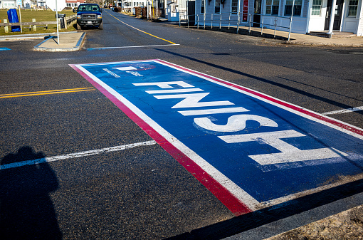 The finish line of the annual Falmouth Road Race.  The race starts in Woods Hole and ends at the finish line located in Falmouth, MA on Cape Cod.  This 7 mile race has been run since 1973 with the proceeds benefiting local charities.