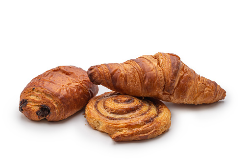 High angle view of croissant, pain au chocola and cinnamon roll, Studio shot: isolated on a white background.
