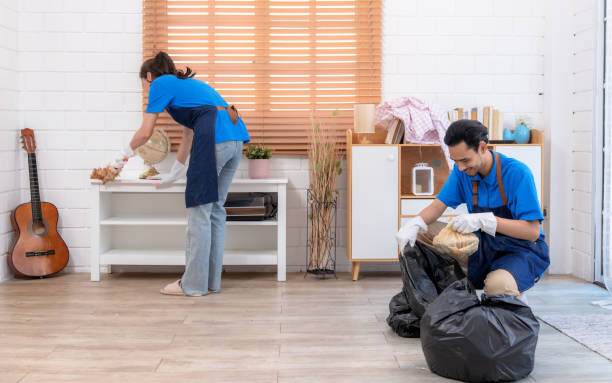 istock Asian cleaning team working in living room. 1490999531