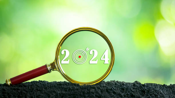 istock Magnifying glass with numbers. Year 2024 search concept, goal, future, start, green background. 1491002711