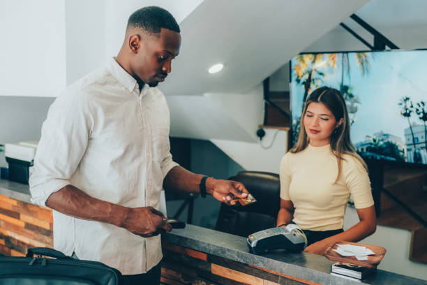istock Businessman in hotel paying contactless 1491003006