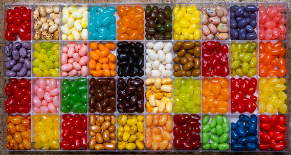 A collage of various candies and chocolates on a white background