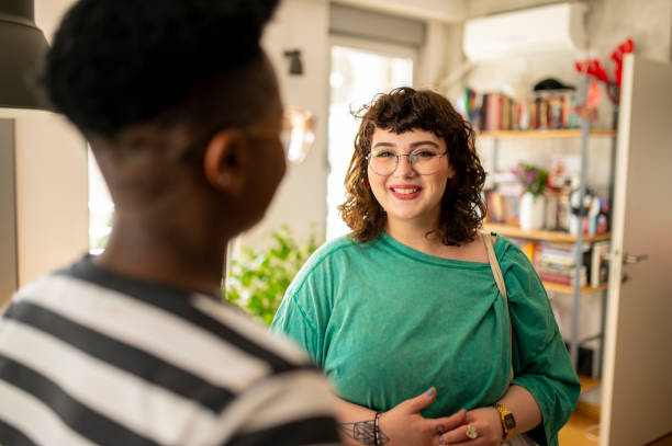 istock Two friends having a conversation at home 1491011533