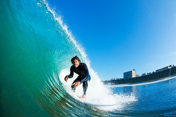 Surfer Surfer riding amazing blue wave north shore stock pictures, royalty-free photos & images