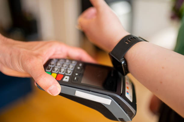 istock Woman paying bill with smartwatch 1491015518