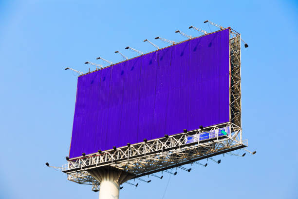 Huge banner and billboard advertising construction high above streets in Bangkok Chatuchak