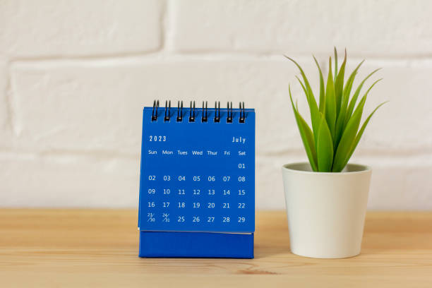 istock Desktop calendar for July 2023 on the table with a space to copy. 1491018088