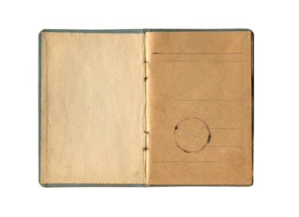 istock small old notebook with vintage yellow brown paper and antique seal stamp and empty first page open and isolated on white 1491021261
