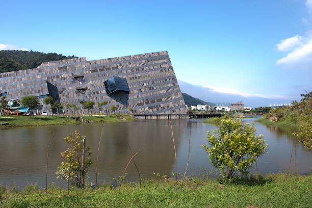 modern museum broad view of a modern museum with nature lake at Yilan in Taiwan frank gehry building stock pictures, royalty-free photos & images