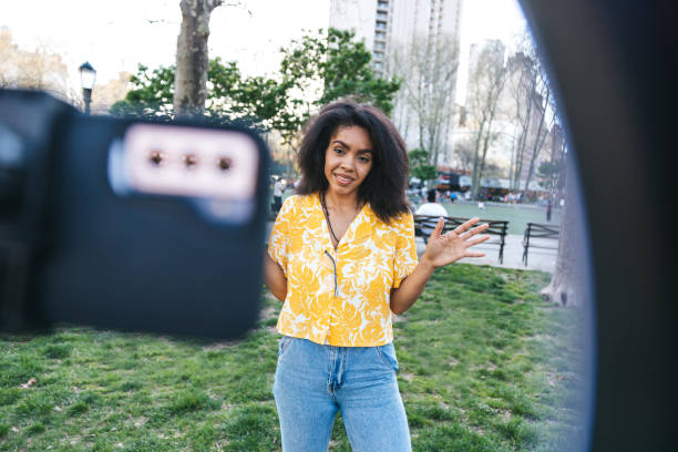 istock Influencer broadcasting a live from a park in New York 1491031798