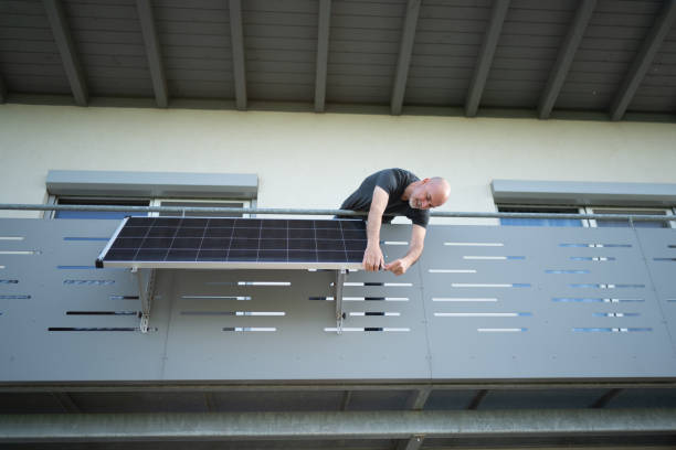 istock man installing solar panel on balcony of his house 1491032893