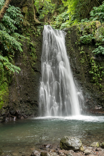 Waterfall Salto De Prago in rain forest in Faial da Terra, Sao Miguel island in Azores