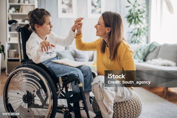 Mom And Young Daughter Having Fun Stock Photo - Download Image Now - Disability, Child, Persons with Disabilities