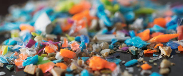 Extreme macro shot on a pile of micro plastic particles. Concept for water pollution and global warming. stock photo