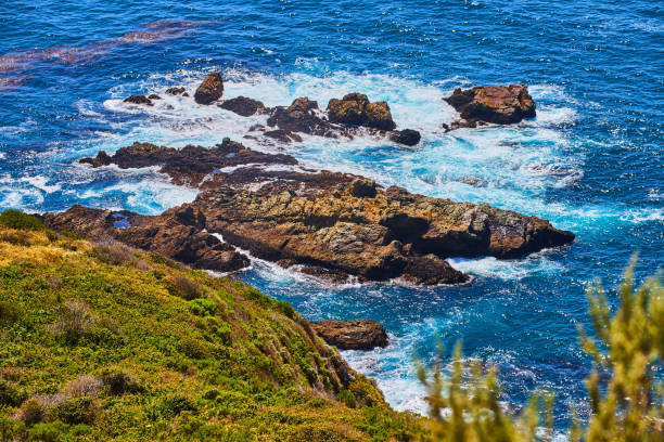 istock Ocean waves crashing into rock formations on west coast 1491040564