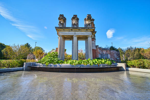 Image of Old ruins of pillars and sculptures set in park