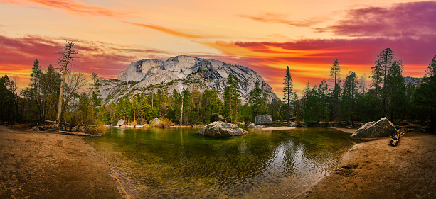 Image of Panorama of iconic Yosemite Half Dome from Mirror Lake at dawn