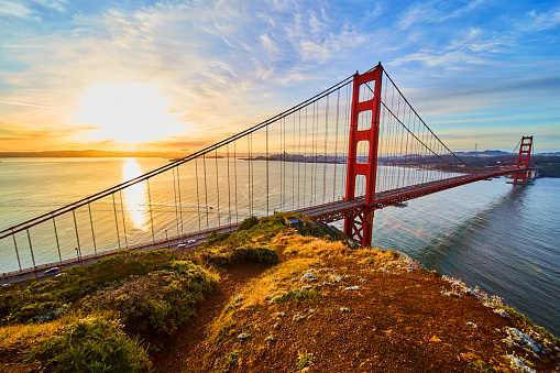 Image of Path on cliffs overlooking Golden Gate Bridge at sunrise from northwest